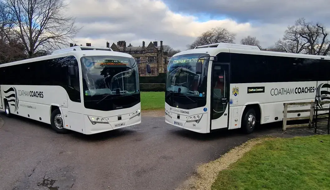 Coaches parked outside building
