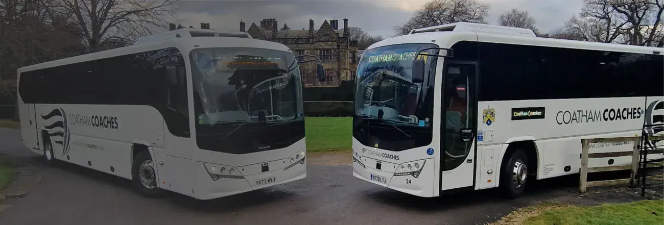 Coaches parked outside building
